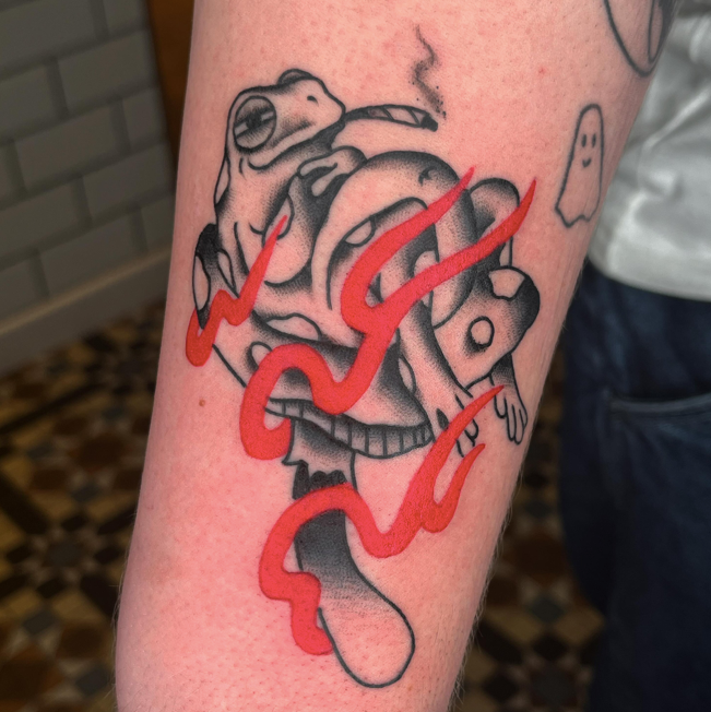 Trad frog tattoo with red flames