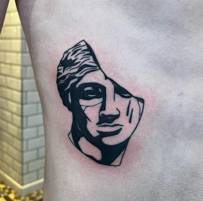 Blackwork broken statue tattoo